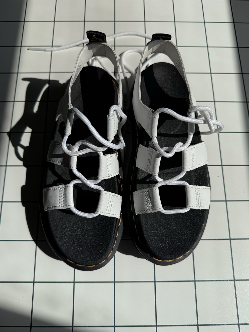 Dr. Martens White Leather Lace-Up Platform Sandals with yellow stitching